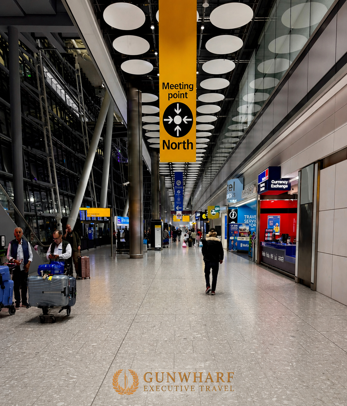 Heathrow Terminal 5 arrivals meeting point beneath Meeting Point North near the orange lifts. Heathrow chauffeur meet and greet collection point for airport transfers and Southampton cruise transfers.