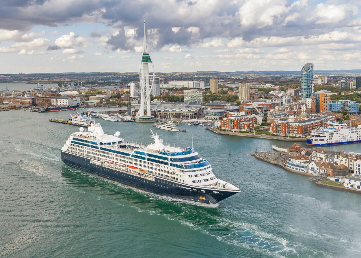 Cruise ship sailing from Portsmouth with Spinnaker Tower and Portsmouth Harbour