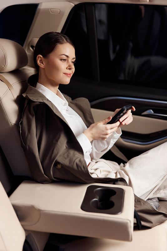 lady sitting in back of car