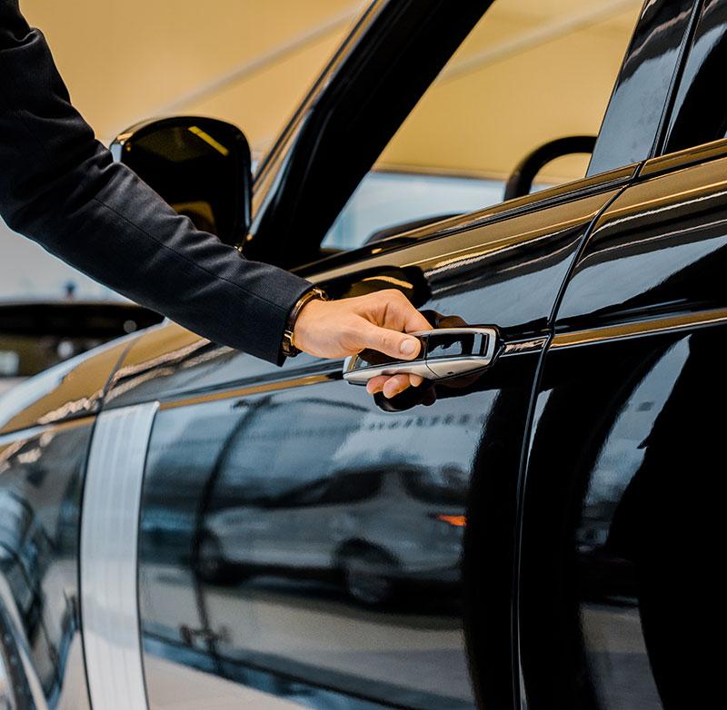 man opening door of car